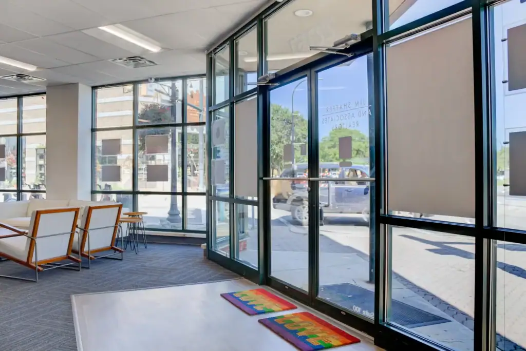 Waiting area with large windows and furniture