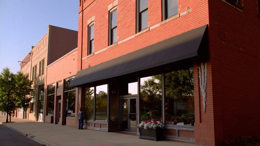 Brick storefront real estate office on a Metro Detroit main street